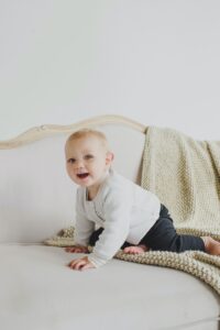 Smiling infant on a bed