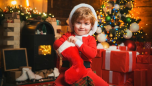 Child digging into his stocking for stocking stuffers